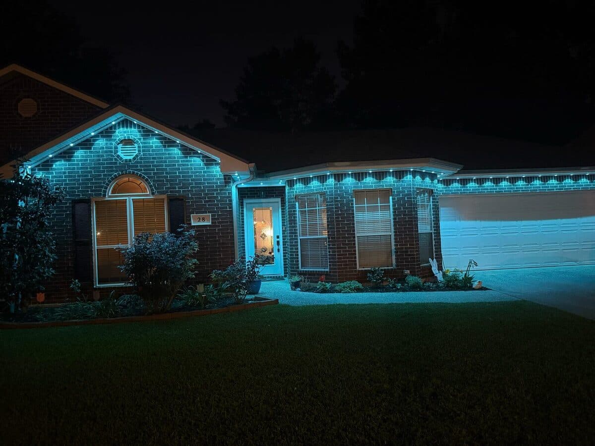 GeauxTrax matte white PETG track on ranch-style single-story home with Govee Permanent Outdoor Pro