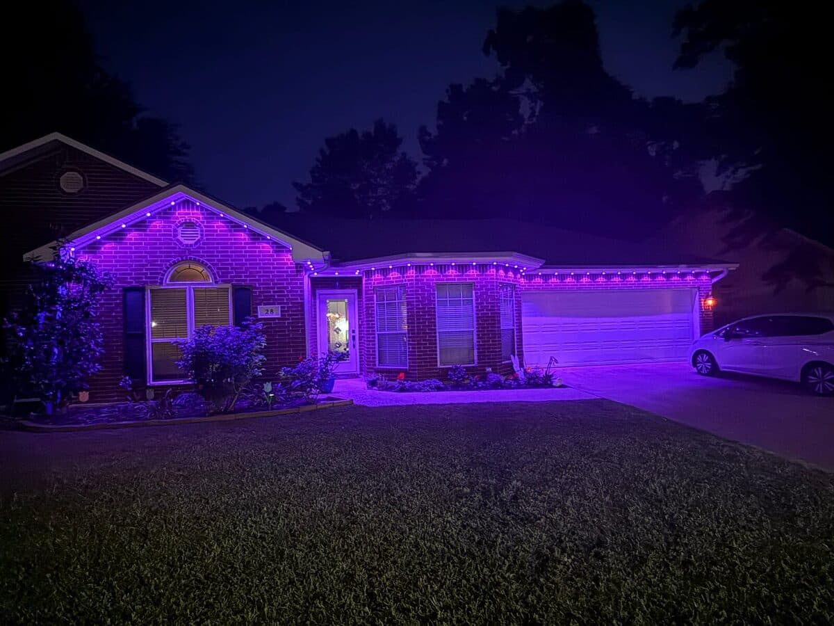Govee Permanent Outdoor Pro with GeauxTrax track on two-story home roofline — full front fascia install