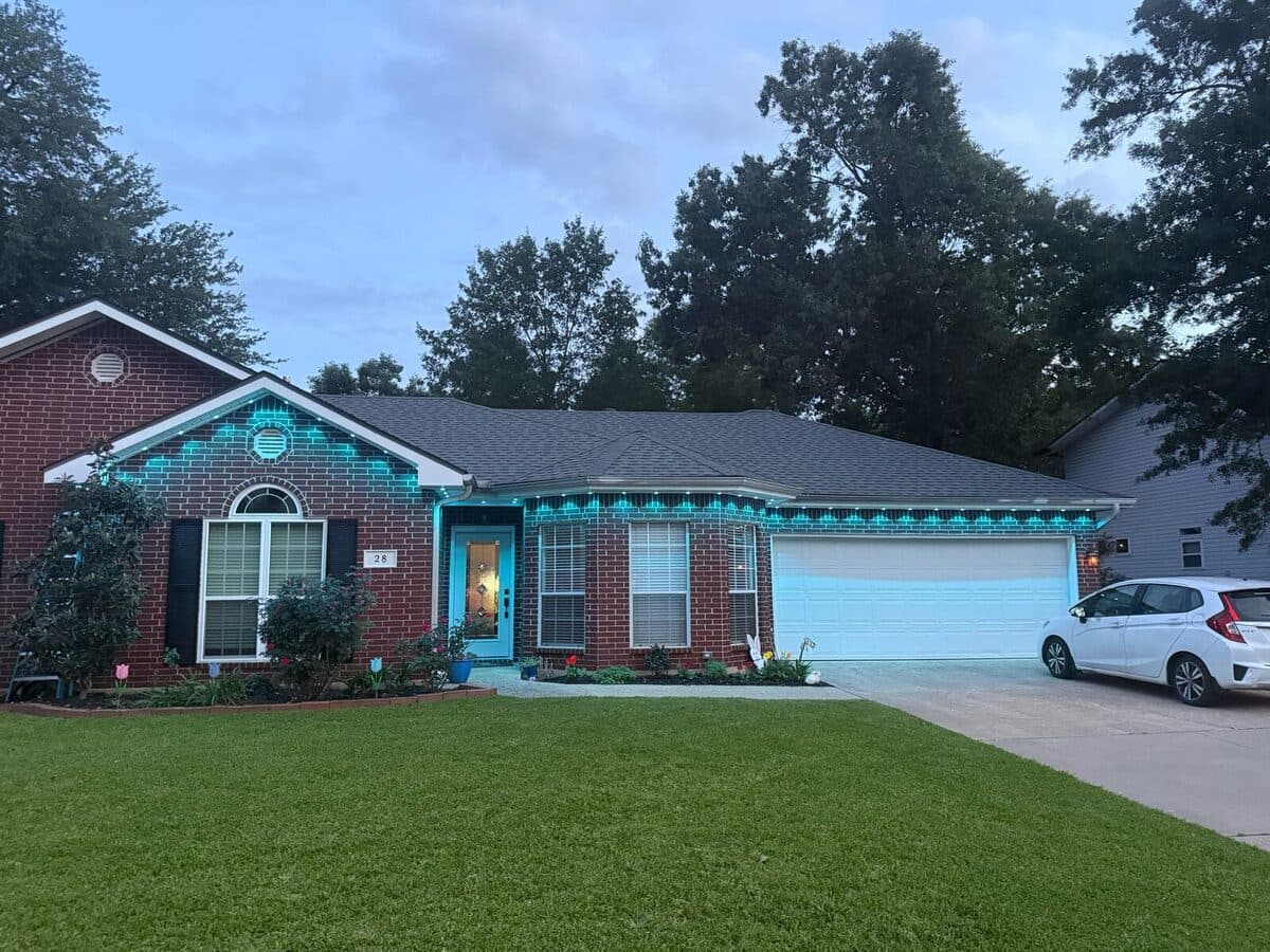 GeauxTrax 200ft kit on large two-story home with detached garage and Govee Permanent Outdoor Pro